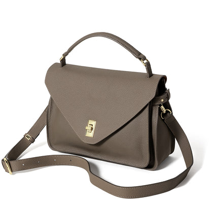 Brown handbag with a gold clasp on a white background