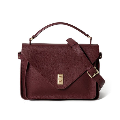 Maroon handbag with a gold clasp on a white background