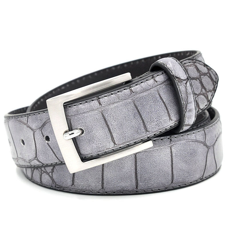 Gray crocodile-patterned belt with a silver buckle on a white background