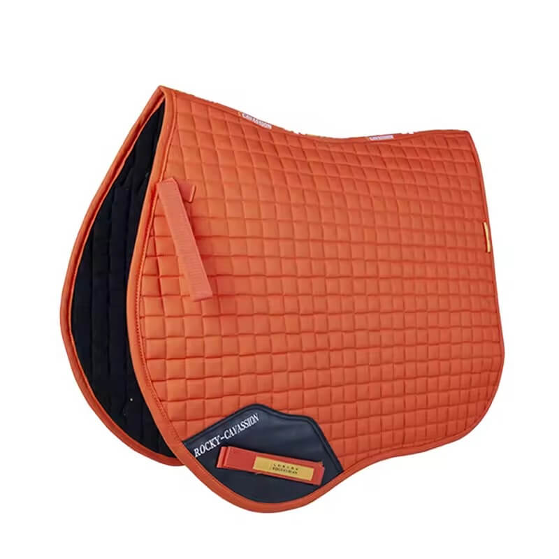 Orange quilted saddle pad with visible brand logo on a white background