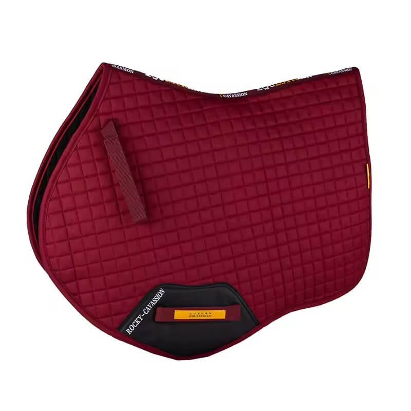 Red quilted saddle pad with black corners on a white background